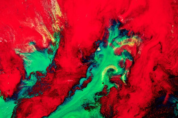 Multicolored creative abstract background Red green alcohol ink Explosion stains blots and strokes of paint luxury marble texture