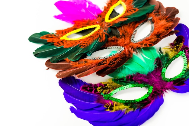 Multicolored decorations for Mardi Gras party on the table.