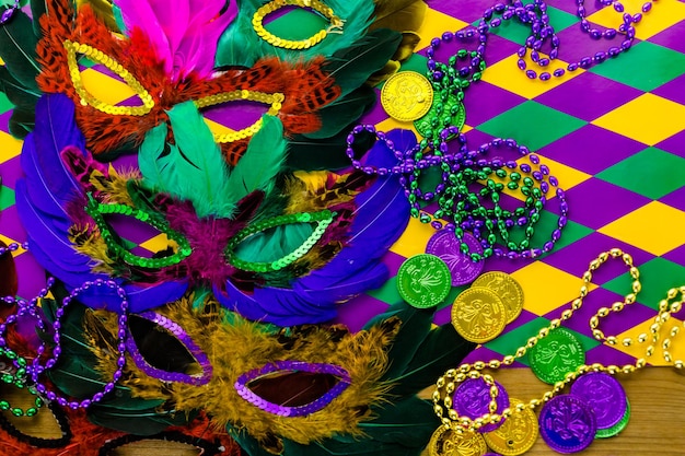 Multicolored decorations for Mardi Gras party on the table.