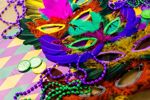 Multicolored decorations for Mardi Gras party on the table.