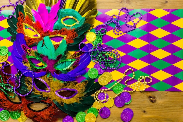 Multicolored decorations for Mardi Gras party on the table.