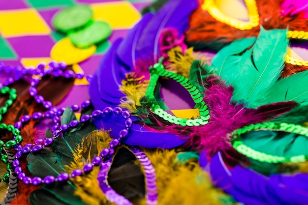 Multicolored decorations for Mardi Gras party on the table.