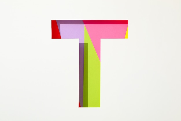 Multicolored letter T on white background