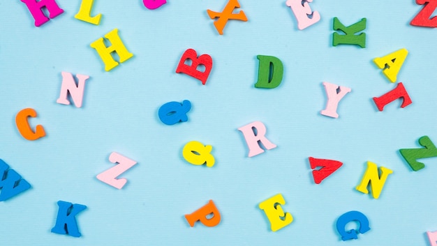 Multicolored letters on a blue background.