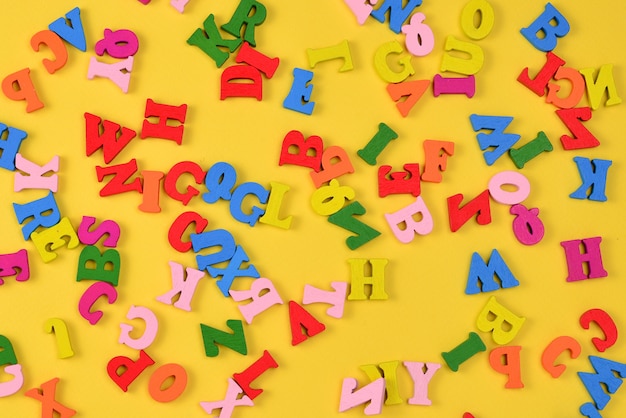 Multicolored letters on a yellow background