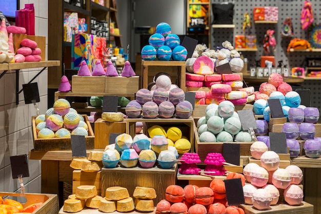 Multicolored natural handmade soap on the counter in the store Closeup Selective focus