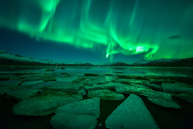 Multicolored northern lights over ice lagoon (Aurora borealis) ,A beautiful green aurora dancing with star at night, Iceland