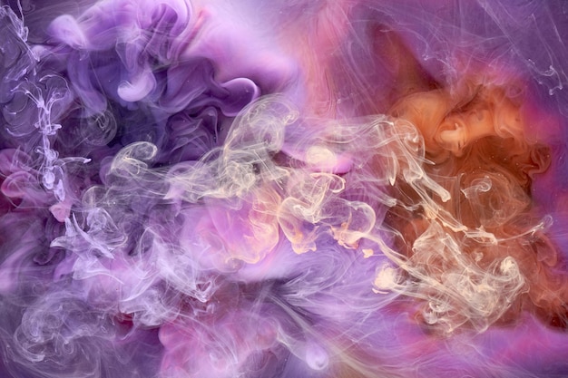 Multicolored orange lilac smoke abstract background acrylic paint underwater explosion