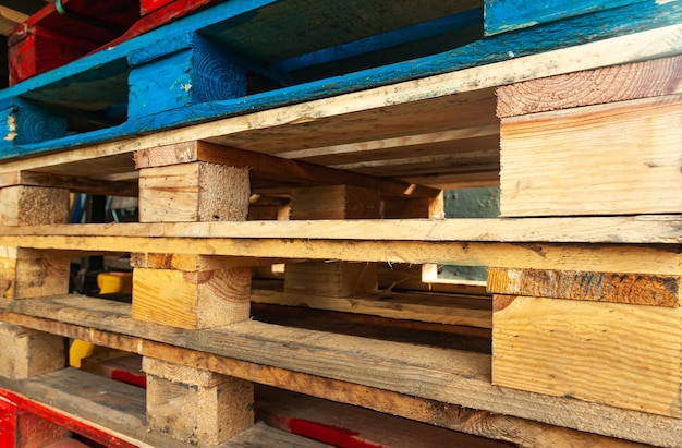 Multicolored pallets stacked on top of each other