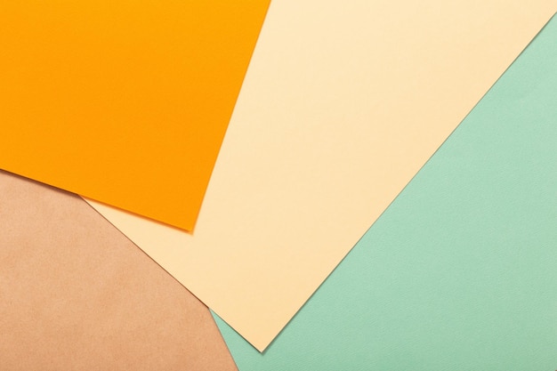 Multicolored paper background from several sheets of cardboard