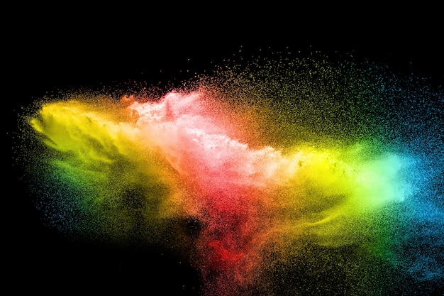 Multicolored particles explosion on black background.