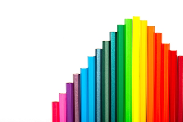 Multicolored pencil ladders on white background