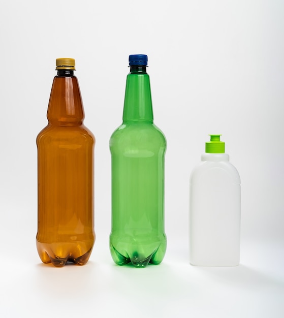 Multicolored plastic bottles on a white background. the concept of recycling plastic. liquids container.