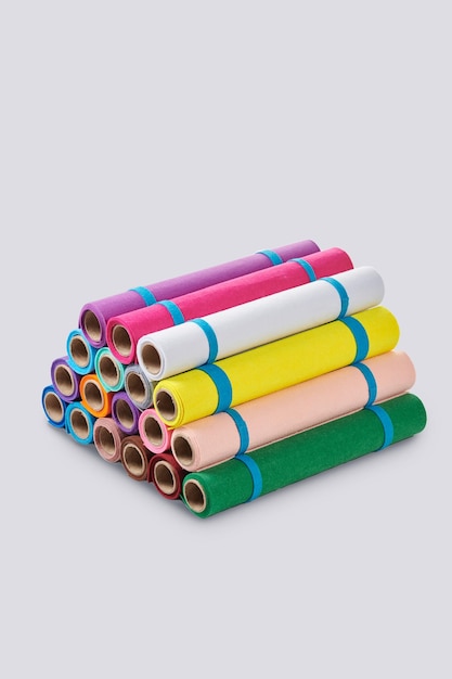 Multicolored soft felt textile material fabric texture in rolls closeup