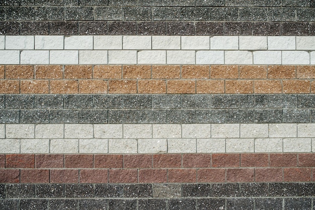 Multicolored striped creatively laid brick wall texture