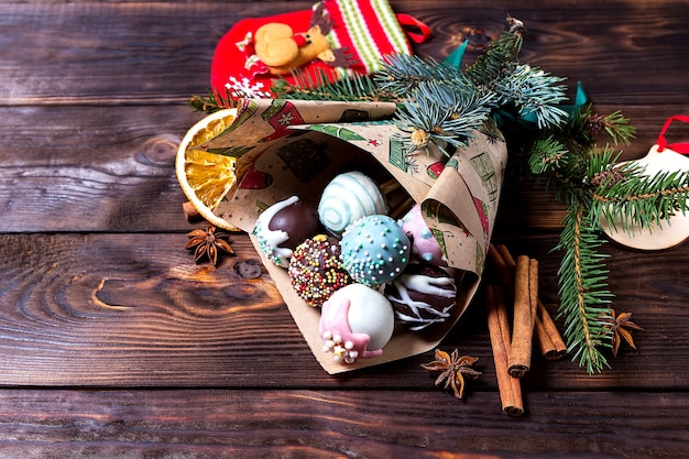 Multicolored sweet cake pops with Christmas decorations