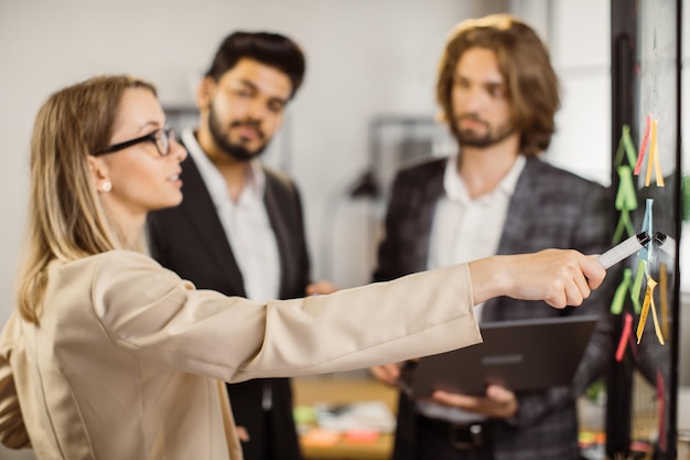 Multicultural team considering new project in meeting room