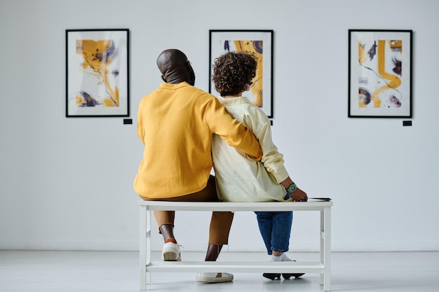 Multiethnic couple visiting art gallery