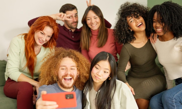 Multiethnic friends taking a selfie at home