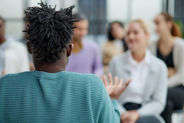 Multiethnic group of people in audience at business conference