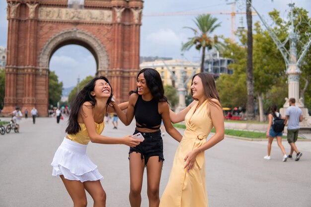 Multiethnic women having fun in city