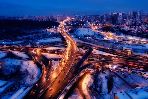 Multilevel traffic interchange night winter drone view