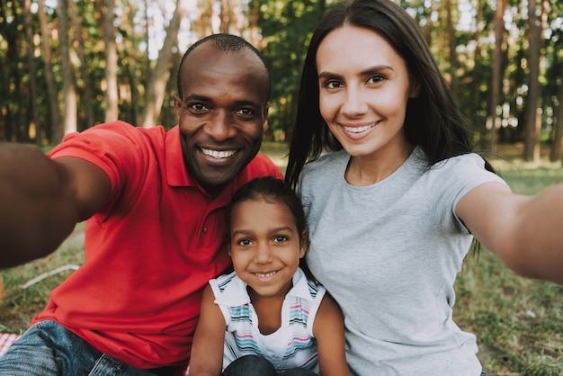 Multinational Family Doing A Selfie On Picnic.