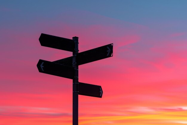 Photo multiple signposts against a vibrant sunset sky offering metaphorical guidance choices and the beauty of twilight