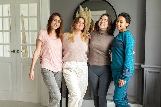 Multiracial friends spending time together indoors