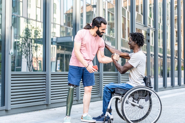 Multiracial happy friends greeting each other people with disability having a chat outdoor