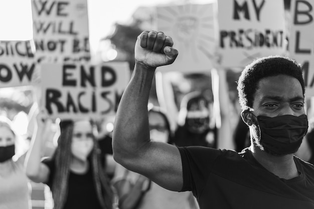 Multiracial people wearing face mask during equal rights protest