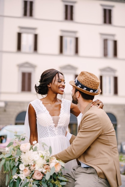 Multiracial wedding couple wedding in florence italy africanamerican bride in a white dress with a