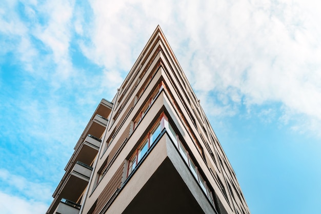 Multistorey residential or business modern building with blue sky