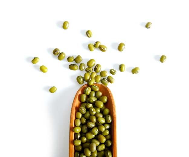 Mung bean in spoon isolated on white.