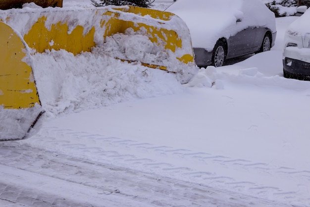 Municipal service tractor removing snow on street after heavy snowfall