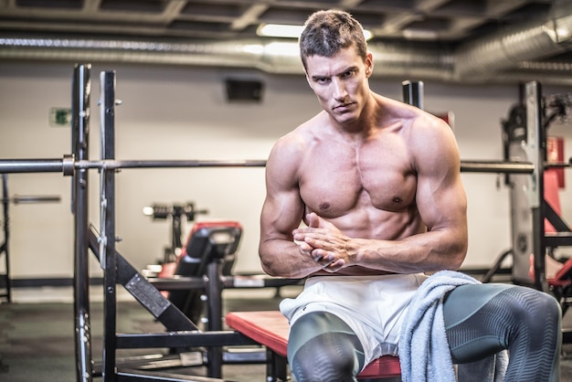 Muscular bodybuilder with towel