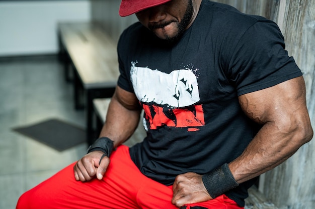 Muscular build guy in black tshirt Portrait of handsome macho looking at the camera