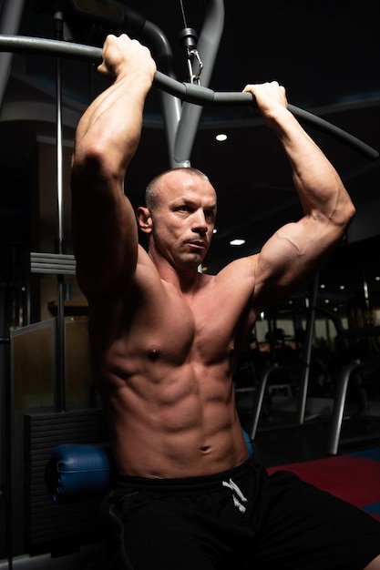 Muscular Man Doing Heavy Weight Exercise For Back