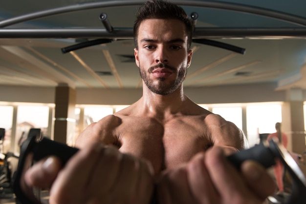 Muscular Man Exercising Chest