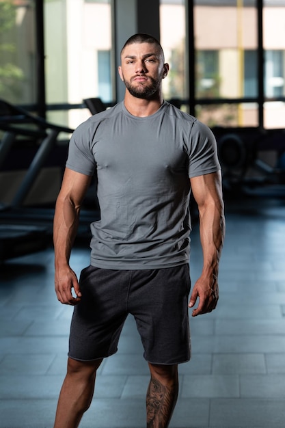 Muscular Man Posing In Gray Tshirt