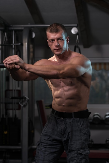 Muscular Man Resting After Exercises  Portrait Of A Physically Fit Young Man In Gym