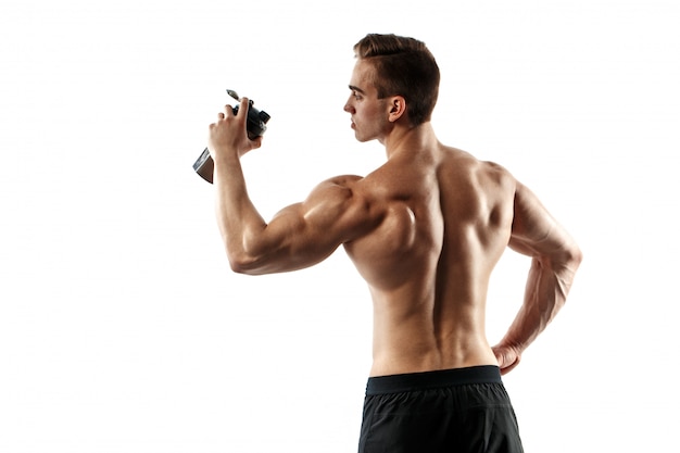 Muscular man with protein drink in shaker over white background