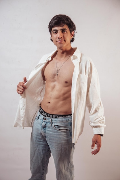 Muscular young man posing in a photo studio