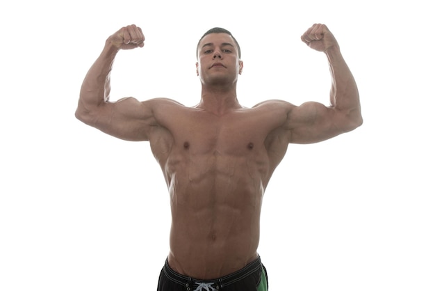 Muscular Young Man Posing In Studio  Isolated On White Background