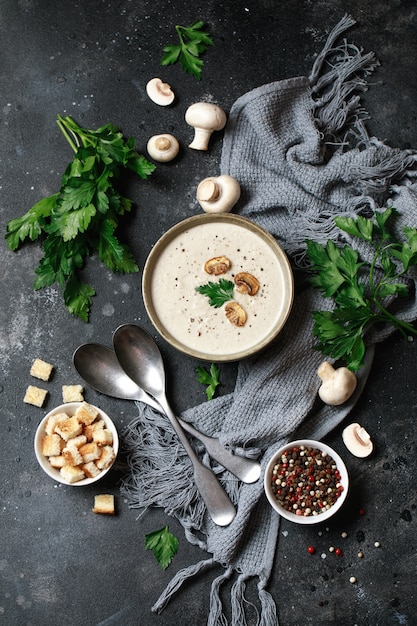 Mushroom cream soup on cloth with ingredients