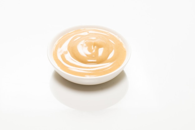 Mushroom sauce in a bowl isolated on white background. Top view.