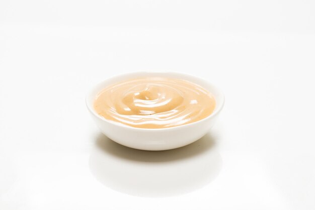 Mushroom sauce in a bowl isolated on white background. Top view.