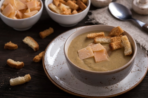 Mushroom soup with toasts and cheese. Vegetarian soup