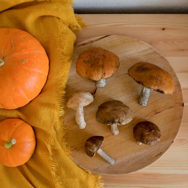 Mushrooms are lying on a wooden table