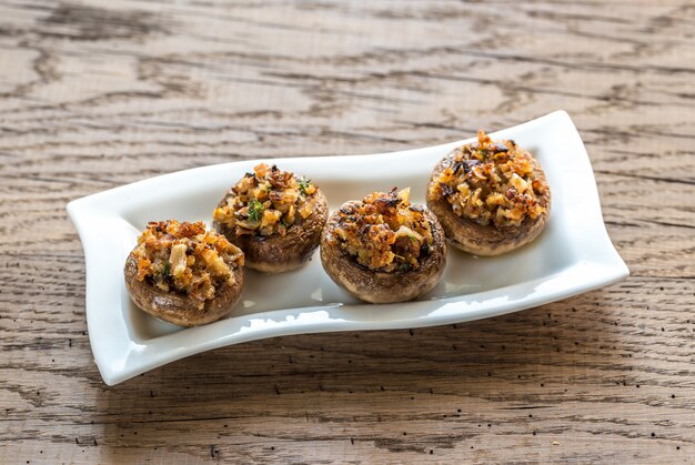 Mushrooms' caps stuffed with mixture of cheese, onion, breadcrum